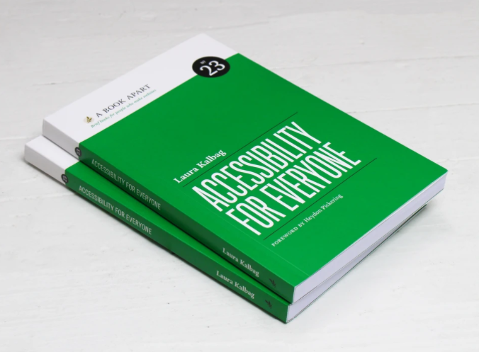 2 copies of Accessibility for Everyone laying on a white surface; They have a green cover and simple white text.