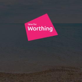 Time for Worthing logo superimposed on a photo of an emoty Worthing beach shoreline and horizon - darkened