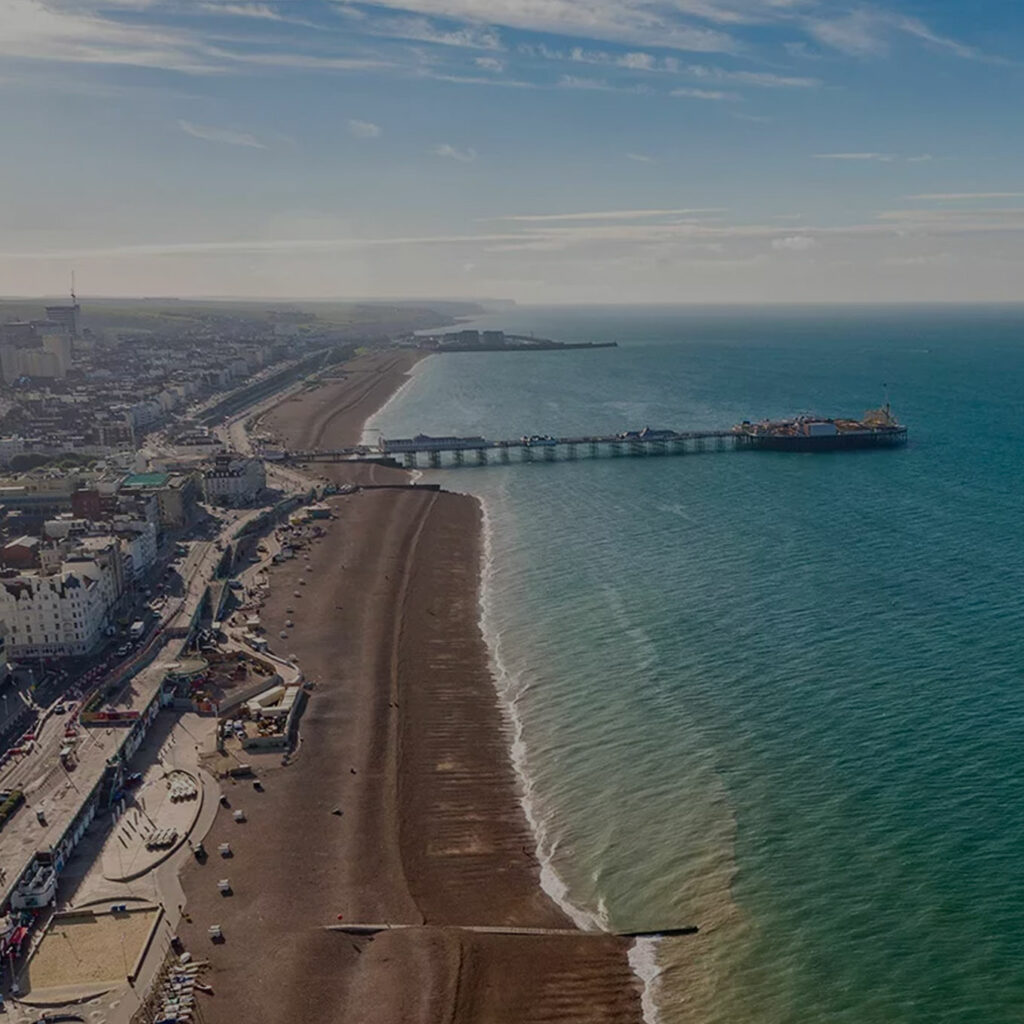 An aerial shot of Brighton showing the seafront and pier.